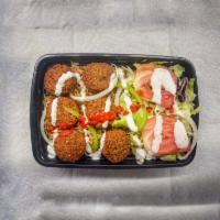 Falafel over Rice · Comes With Aromatic Basmati Rice, Falafel, Grilled Onion, Green
pepper, Cilantro, Salad (Let...