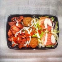 Combo/Mix Over Rice (2) · Comes With Aromatic Basmati Rice, Falafel and Grilled
Chicken/Lamb, Grilled Onion, Green pep...