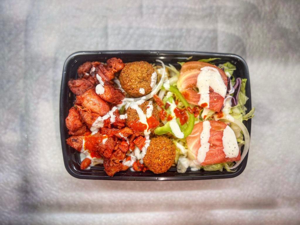 Combo/Mix Over Rice (2) · Comes With Aromatic Basmati Rice, Falafel and Grilled
Chicken/Lamb, Grilled Onion, Green pepper, Cilantro, Salad (Lettuce, Red Cabbage & Tomato) and Sauce (White, Hot, Green & BBQ)
