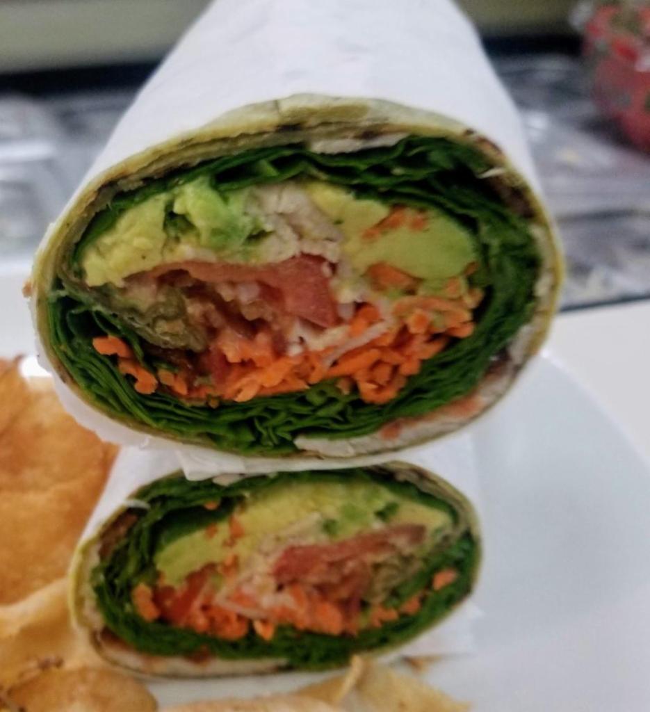 California Wrap · Crispy bacon, avocado, arugula, carrots, baby spinach, tomatoes and honey mustard. Served with our famous homemade potato chips.