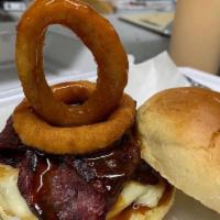 Texas Burger · Angus beef with pepper Jack cheese, beef bacon, BBQ sauce, and topped with an onion ring.