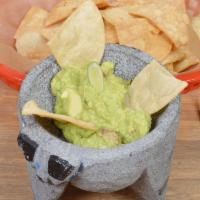 Side of Guacamole · Avocado, tomatoes, onion, cilantro, Serrano peppers, lemon juices and served with corn chips.