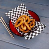Fried Calamari · All natural squid hand dusted seasoned coating. Served with sweet chili sauce.