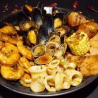 Classic Cajun Seafood Combo · 1 lb. shrimps, 1 lb. mussels, 1 lb. clams, 1/2 lb. squid additionals: spam, potato, corn.