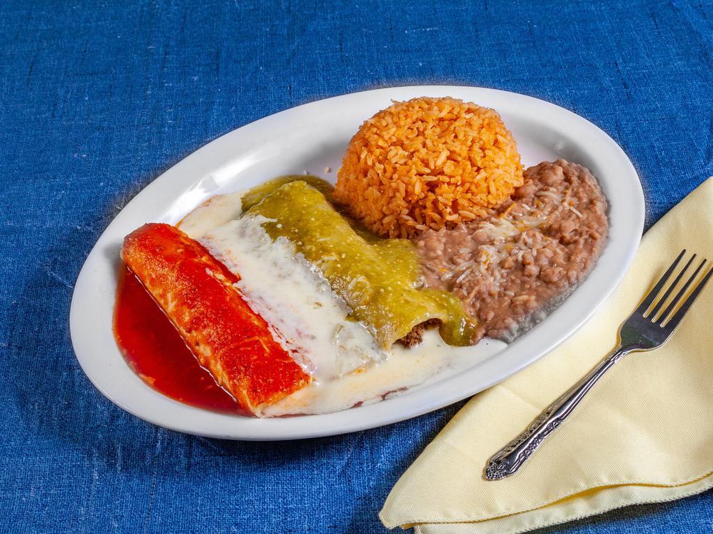Banderas Enchiladas · 3 enchiladas made on corn tortilla, chicken, beef and chicken topped with red enchilada sauce with cheese sauce and verde sauce. Served with Mexican rice and refried beans.