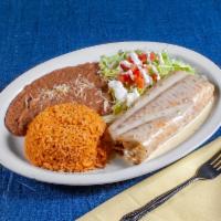 Rica Chimichanga · Large chimichanga stuffed with spinach and chicken, served with our Mexican rice, refried be...