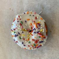 Vanilla Cake Donut · Cake donut dipped in vanilla frosting and coated with sprinkles