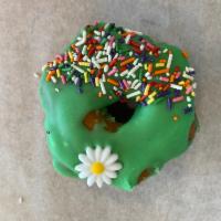 Green Eyes Donut · Raised donut dipped in green (vanilla) frosting and coated with sprinkles
