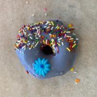 Purple Heart Donut · Raised donut dipped in purple (vanilla) frosting and coated with sprinkles