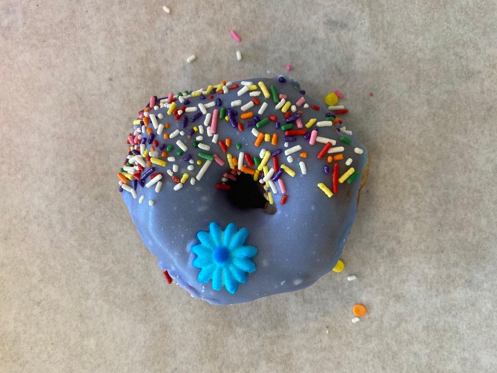 Purple Heart Donut · Raised donut dipped in purple (vanilla) frosting and coated with sprinkles