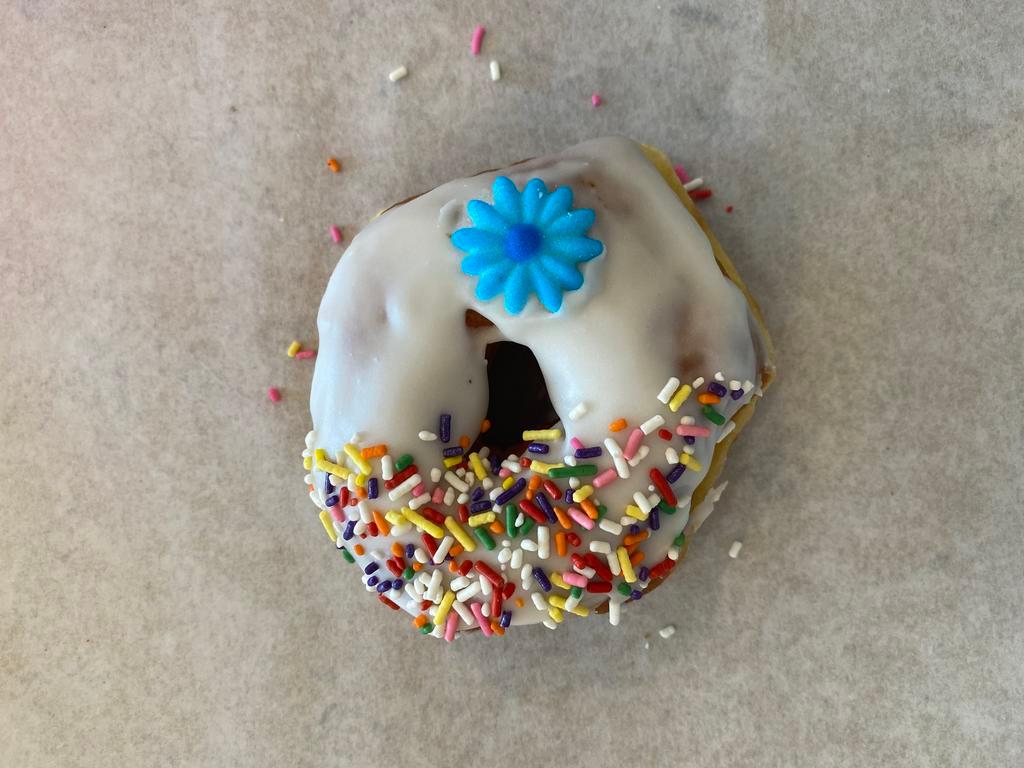 Vanilla Frosted Donut · Raised donut dipped in vanilla frosting and topped with sprinkles