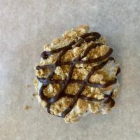 S'mores Donut · Raised donut dipped in marshmallow frosting and topped with graham cracker crumbles and driz...