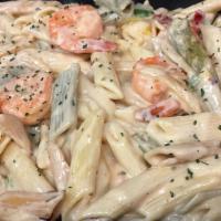 Shrimp Rasta Pasta · Caribbean style 10 pieces shrimp and pasta engulfed in a rich creamy spiced Alfredo sauce. E...