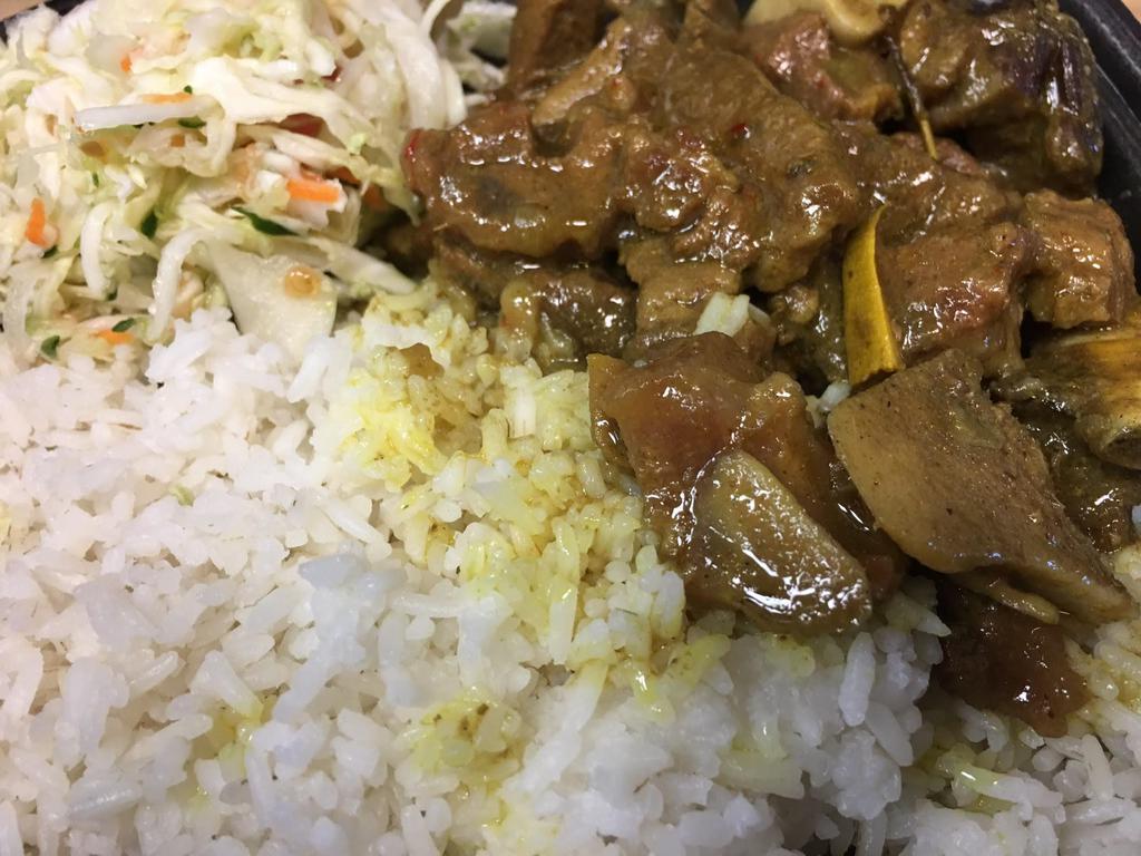 Curried Goat · Served with choice of side and choice of 2 salads.