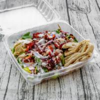Chicken Shawarma Salad · Salad with thin slices on roasted meat.