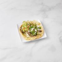 Bisteck Taco · Steak, onions, cilantro,lettuce, tomato, cream, cheese and guacamole.