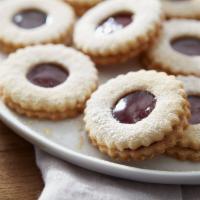 Mini Linzer Cookies · The buttery, tender, linzer cookies are filled with raspberry jam and generously dusted with...