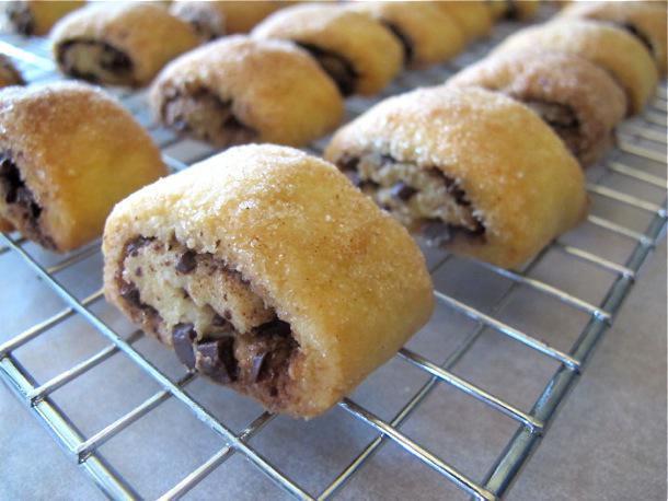Chocolate Rugelach by the 1/2lb. · A much-loved Jewish holiday treat, rugelach (pronounced rug-a-lah) are miniature pastries posing as cookies. They’re made by rolling a buttery, flaky dough around a sweet filling of chocolate.