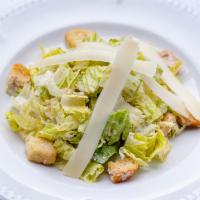 Insalata alla Cesare · Romaine lettuce, garlic croutons, shaved Parmigiano-Reggiano, homemade Caesar dressing.