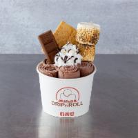 S'More Ice Cream Roll · Chocolate ice cream mix in with graham cracker, topped with whipped cream, graham cracker, t...