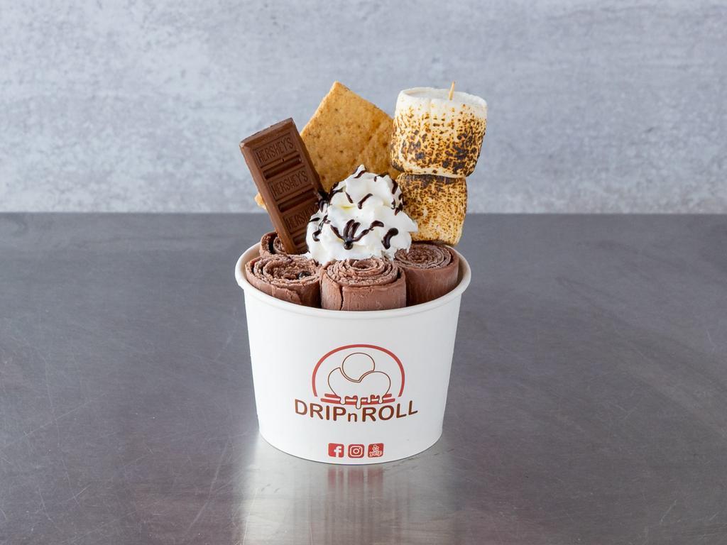 S'More Ice Cream Roll · Chocolate ice cream mix in with graham cracker, topped with whipped cream, graham cracker, toasted marshmallows, hersey's bar and chocolate drizzle.