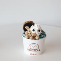 Cookie Monster Ice  Cream Roll · Blue vanilla ice cream mix with cookie dough pieces and oreo, topped with whipped, oreo, coo...