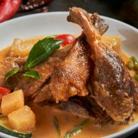 Swimming Duck · Roasted crispy duck in red curry sauce with pineapple, tomatoes, onion, peppers, zucchini, a...