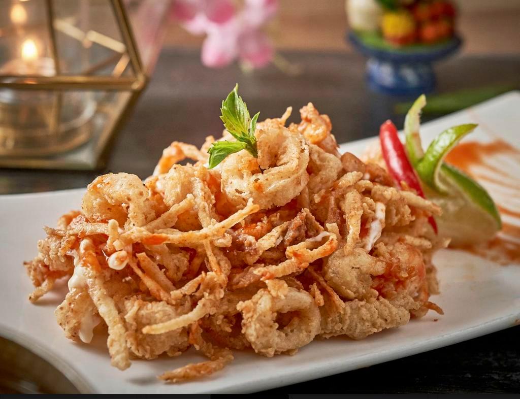 Coco Calamari · Fried calamari with young coconut served with mayonnaise and Topaz sweet Sriracha sauce.