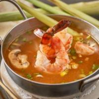 Tom Yum Shrimp Soup · The most famous traditional Thai spicy and sour soup, with Thai herbs, lemongrass, onion, ch...