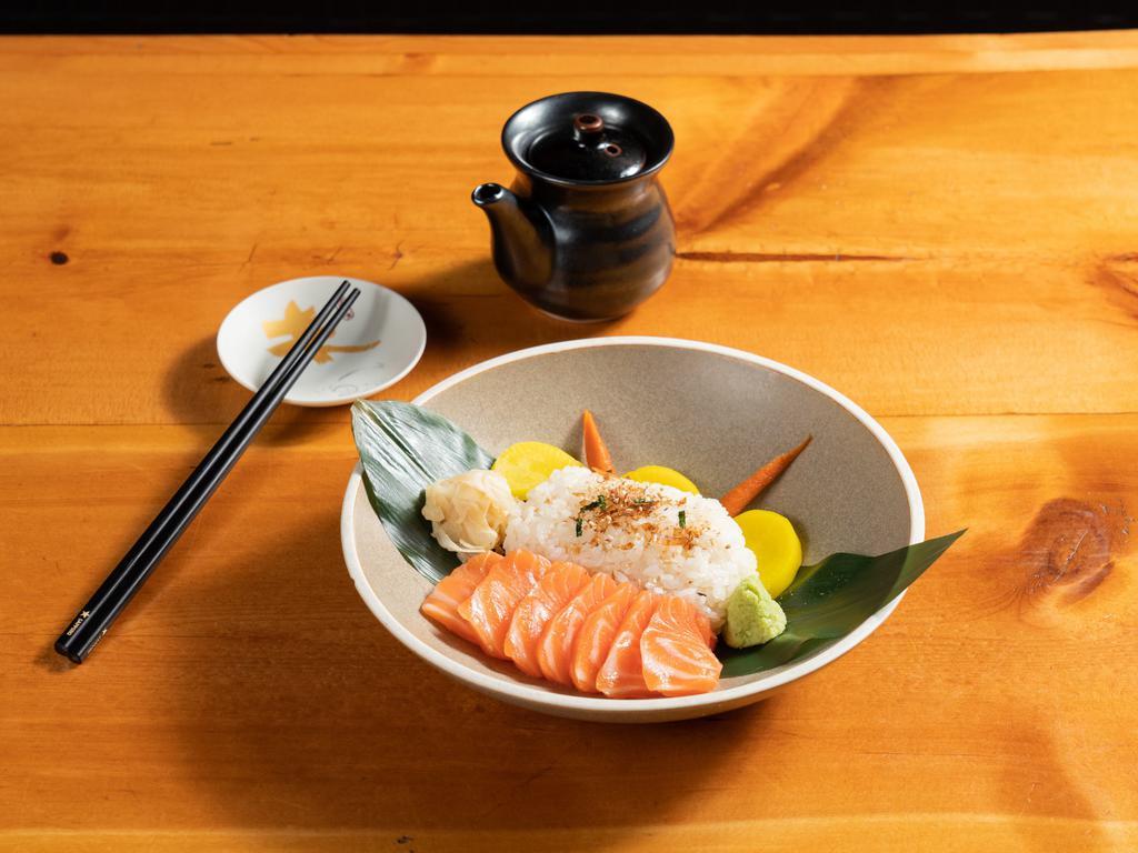 Sake Don/Tekka Don · 7 pieces of sliced salmon or tuna over seasoned rice.