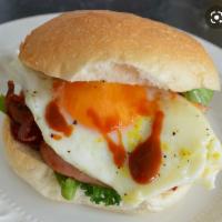 Bacon eggs & cheese hero · A long sandwich on a roll. 