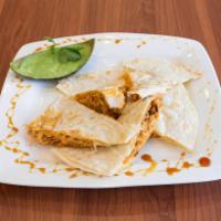 Quesadilla · A Mexican dish, consisting of a tortilla that is filled with cheese and chicken and then gri...