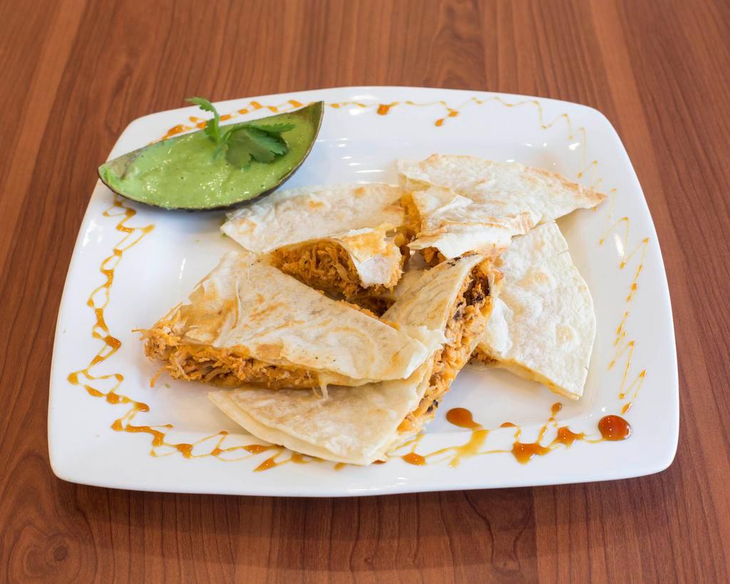 Quesadilla · A Mexican dish, consisting of a tortilla that is filled with cheese and chicken and then grilled.
