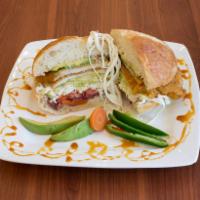 Torta Mexicana Sandwich  · Mexican style sandwich on a fresh and crusty baguette, topped with chicken, avocado, and bea...