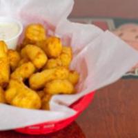 Beer Battered Fresh Cheese Curds · Squeaky-fresh local cheese curds dipped in beer batter and fried to order. Served with bacon...