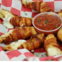 Bacon Wrapped Mozzarella Sticks · Thick-cut bacon spiraled around 4 wonton-wrapped mozzarella sticks and then fried. Sliced an...