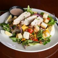 Saloon Salad · A large portion of mixed greens with choice of dressing, tomatoes, diced red onions, black o...
