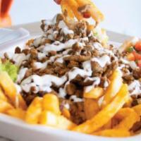 Calaca Fries · French fries, steak or chicken guaacamole, pico de gallo, sour cream and cheese dip.