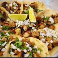 Tacos · Served with onion, cilantro, lime and taquera sauce on the side 
