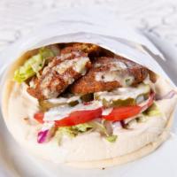 Falafel Gyro · Freshly deep fried falafels, topped with tahini sauce and wrapped in a soft, warm pita.