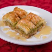 Baklava · Delicate layers of filo pastry filled with walnuts and pistachio, moistened with a light sug...