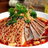 🌶️ Sliced Beef and Ox Triple in Chili Sauce 夫妻肺片 · Tender beef slices are served in a rich, spicy hot sauce and topped with peanut flakes and c...