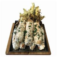 Street Corn									 · Corn, mayonnaise spread, El Mexicano granulated cotija cheese, tajin and minced cilantro