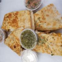 Steak Quesadilla · With onions and peppers. Served with sour cream, spicy salsa and pico de gallo.