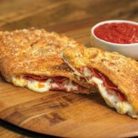Pepperoni Calzone · Our handmade dough stuffed with pepperoni and our signature three cheeses; served with a sid...