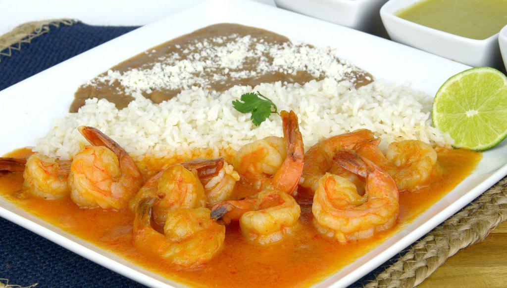 Caldo de Camaron · Shrimps cooked slowly with tomato juice and aromatic herbs.