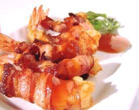 San Jose · Shrimps wrapped with bacon and staffed with cheese, serrano peppers served with rice and salad.