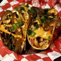 Chorizo Me Burrito · Made with chorizo, bacon, grilled peppers, onions, deep-fried jalapenos, pico de gallo, frie...