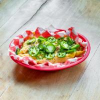 The It's Chili Fries · Seasoned steak fries smothered in chili, queso, shredded cheese blend, green onions & fresh ...