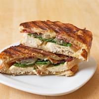 P5. Road Runner Panini · Grilled chicken, grilled onions, spinach, muenster cheese, beef bacon, lettuce, and tomato.